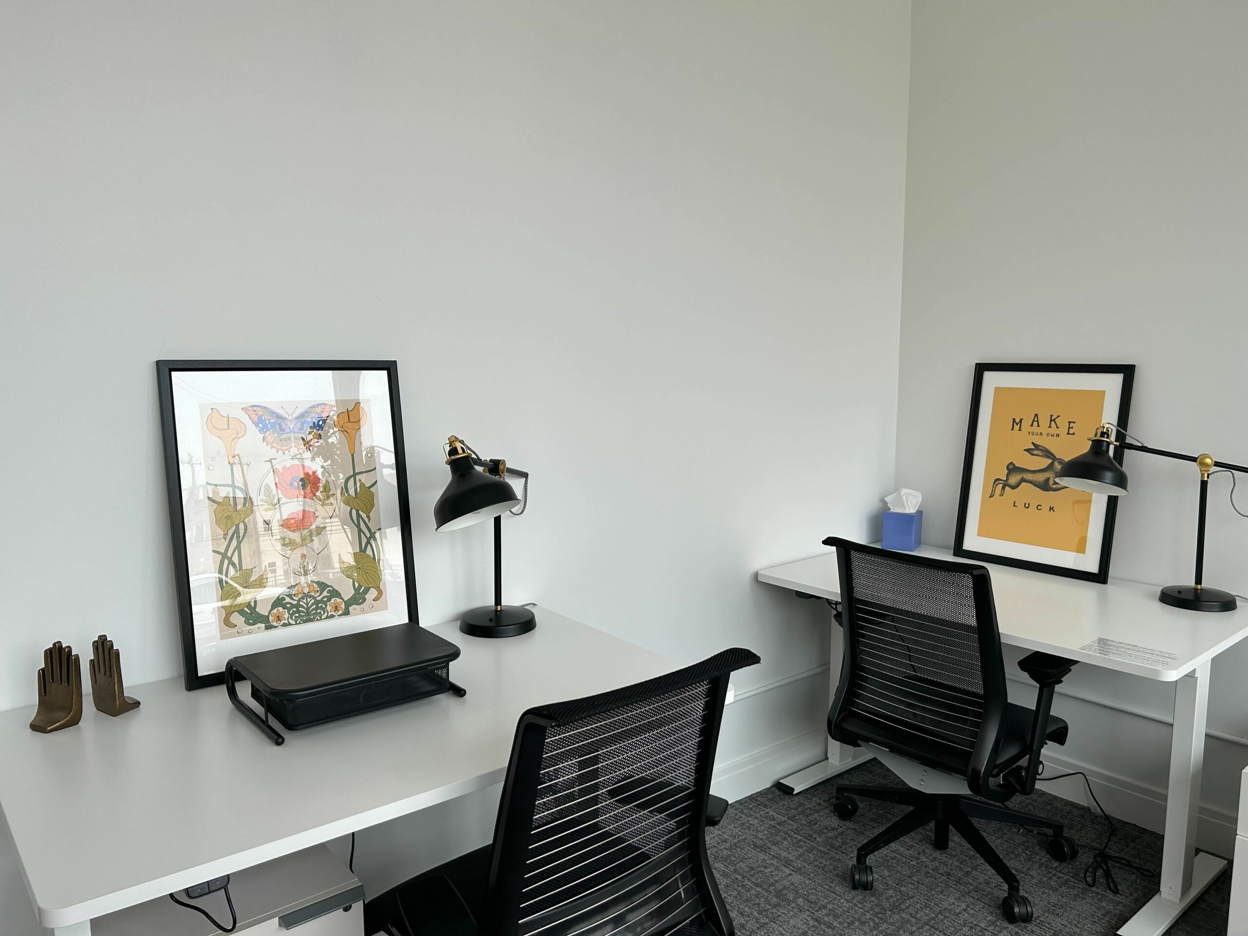 Two desks for rent with standing desks and monitors